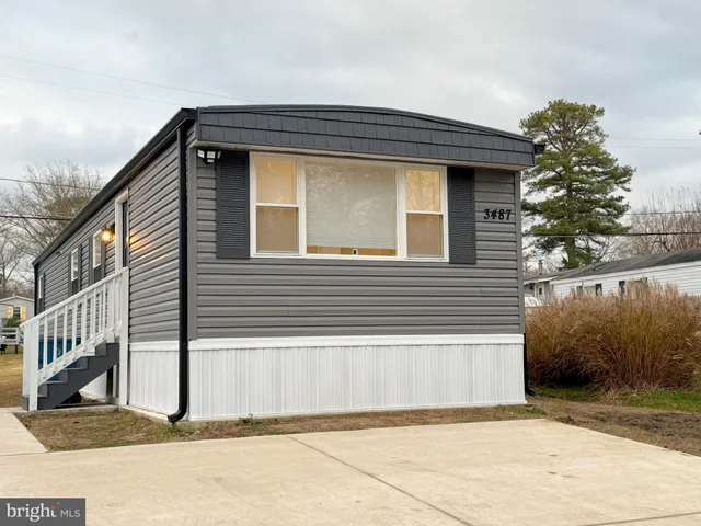 a front view of a house with a garage