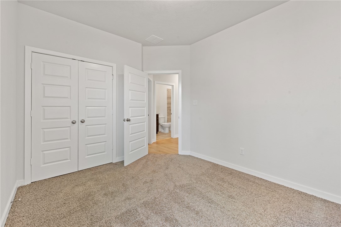 2412 Rooke Road Bryan, TX 77807 - Photo 33 of 35 an empty room with closet area