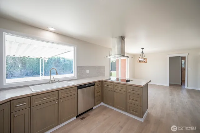 a kitchen with sink and window