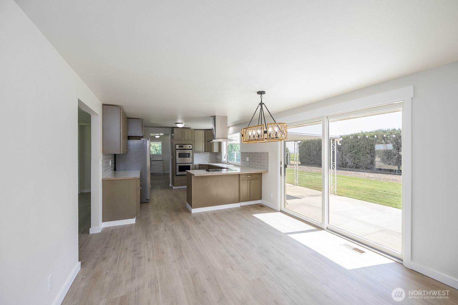21807 Southwest 1st Road Quincy, WA 98848 - Photo 17 of 40 a kitchen with stainless steel appliances granite countertop a stove and a refrigerator
