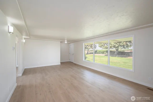 a view of an empty room with a window