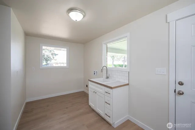 a bathroom with 2 sink and a mirror