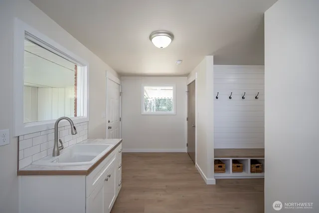 a bathroom with a sink and a mirror