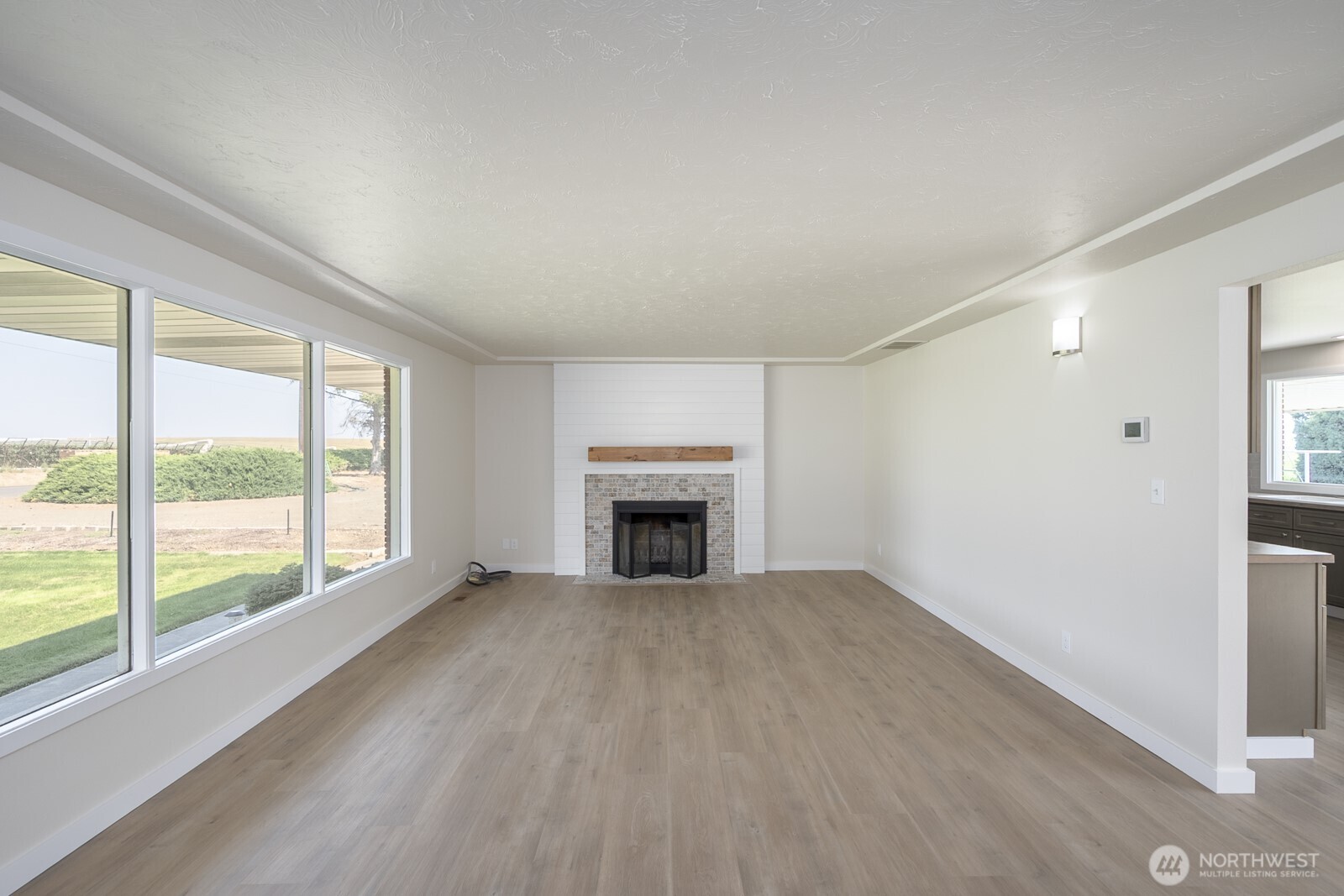 21807 Southwest 1st Road Quincy, WA 98848 - Photo 28 of 40 a view of an empty room with a window and fireplace