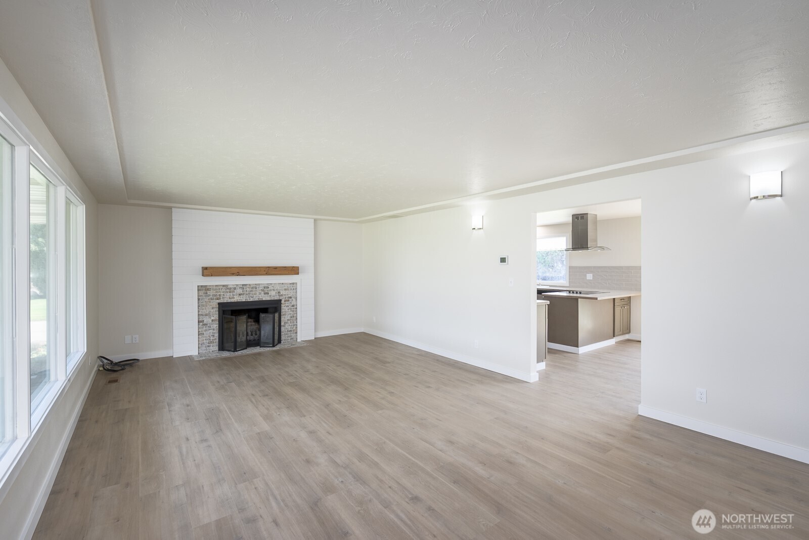 21807 Southwest 1st Road Quincy, WA 98848 - Photo 29 of 40 a view of empty room with wooden floor and fireplace
