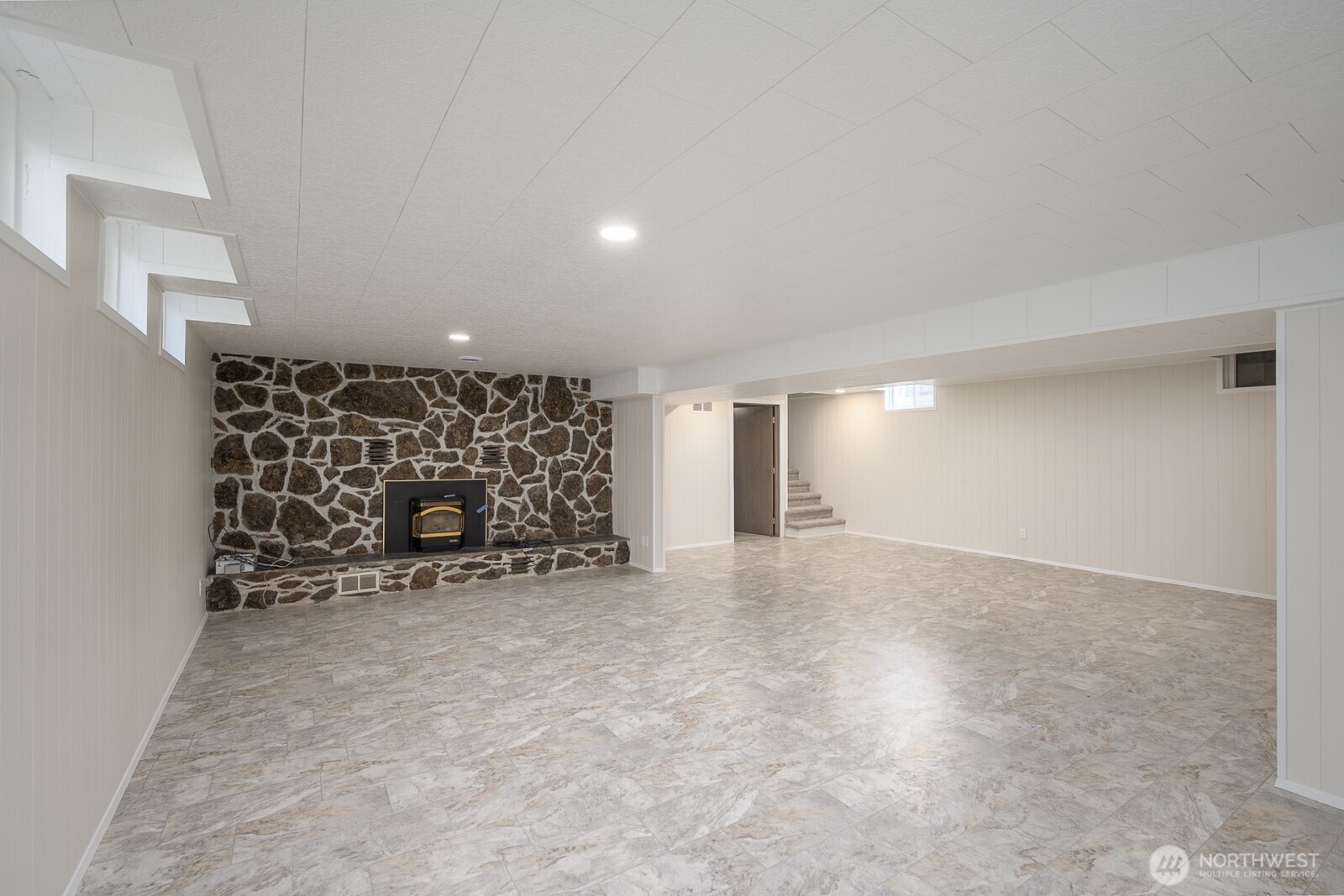 21807 Southwest 1st Road Quincy, WA 98848 - Photo 30 of 40 an empty room with a fireplace and painted walls