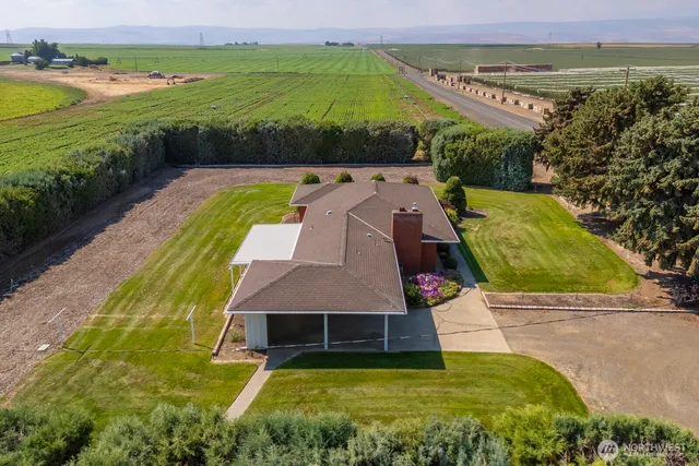 a view of a swimming pool with an outdoor space and seating area