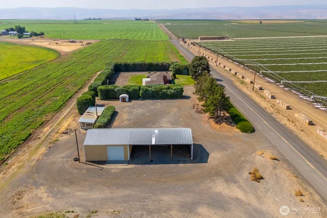 a view of a swimming pool with a yard