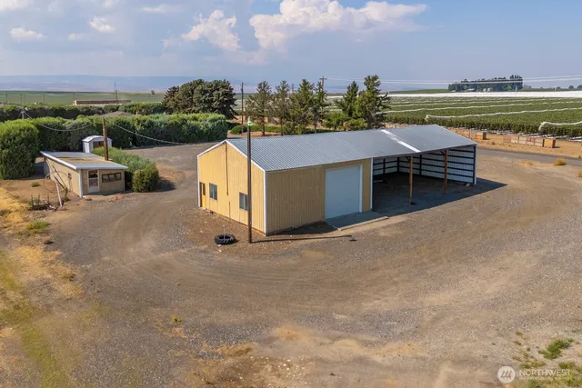 a view of a terrace with a bench and lake view