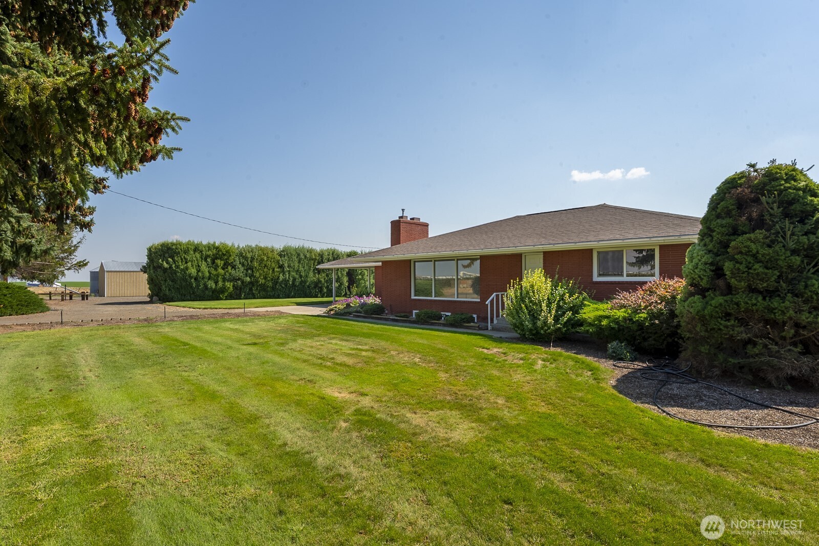 21807 Southwest 1st Road Quincy, WA 98848 - Photo 4 of 40 a front view of a house with a yard