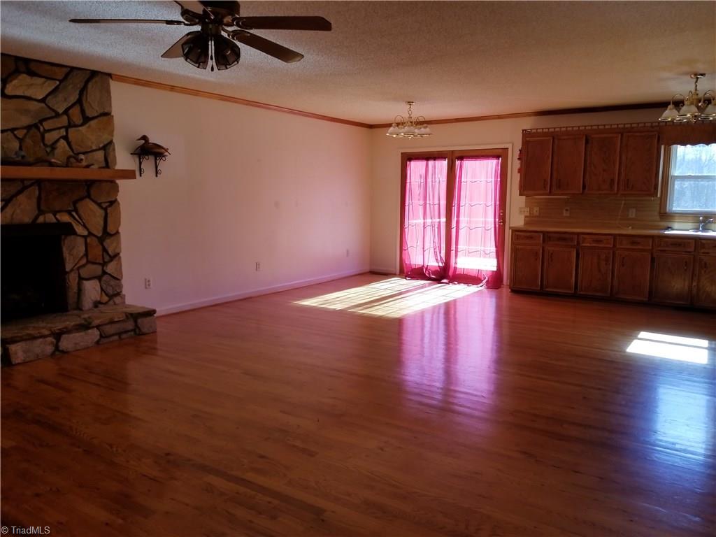 718 Wiley Royal Road Elkin, NC 28621 - Photo 11 of 27 View from front door facing fireplace and dining area