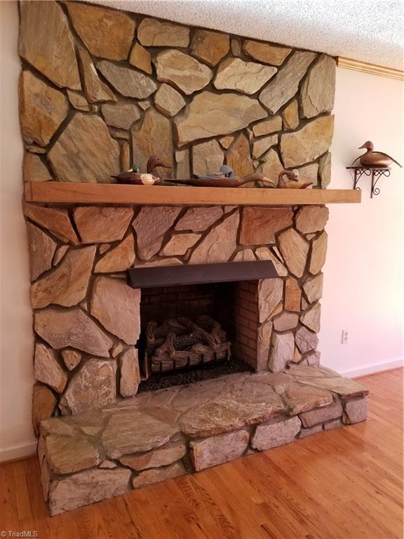 718 Wiley Royal Road Elkin, NC 28621 - Photo 12 of 27 Custom stone fireplace with gas logs