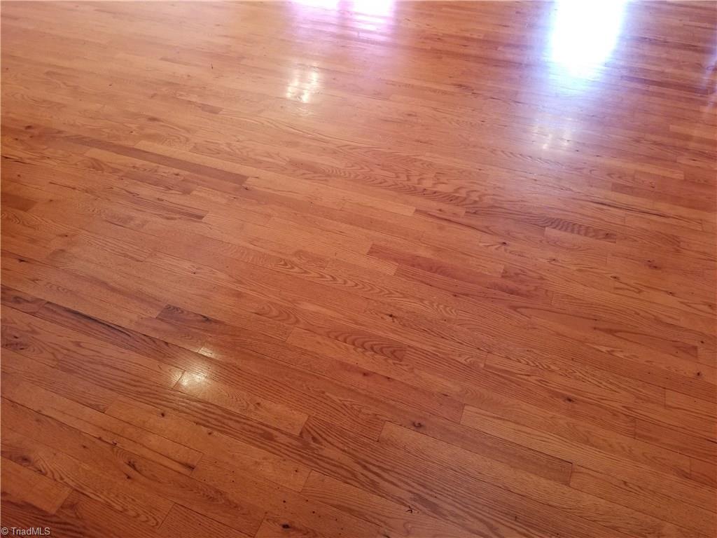 718 Wiley Royal Road Elkin, NC 28621 - Photo 16 of 27 Well maintained hardwood flooring in the living room, kitchen and dining area