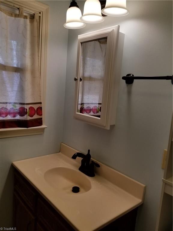718 Wiley Royal Road Elkin, NC 28621 - Photo 22 of 27 Master bath sink and vanity