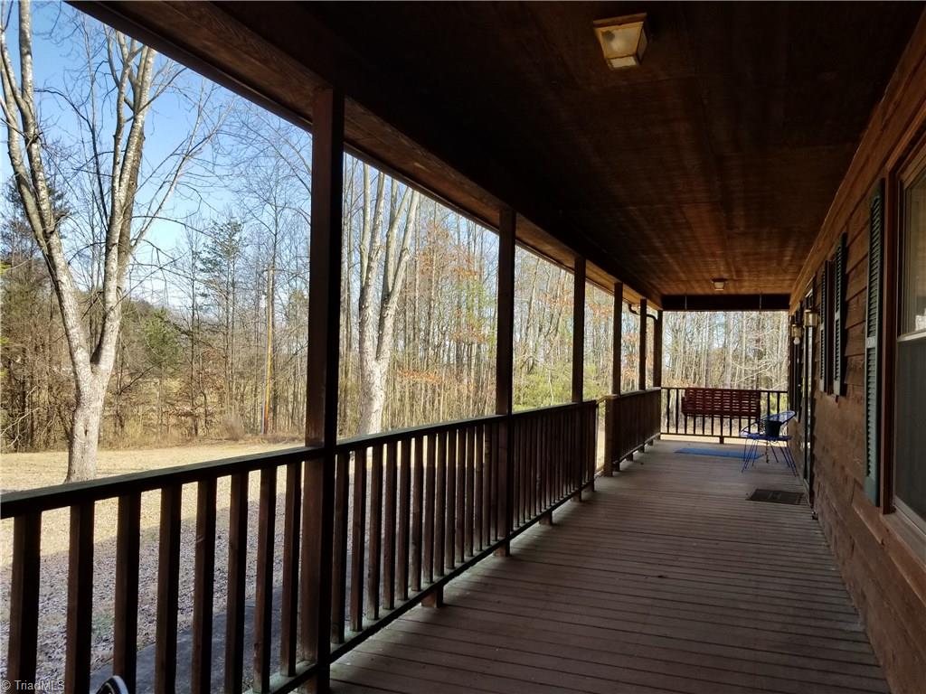 718 Wiley Royal Road Elkin, NC 28621 - Photo 4 of 27 Full length front porch with swing.