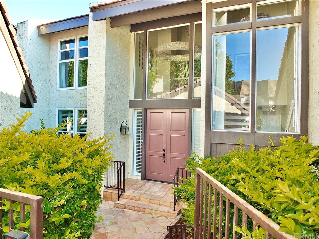 4001 Marion Way Long Beach, CA 90807 - Photo 1 of 1 view of a house with large windows and plants