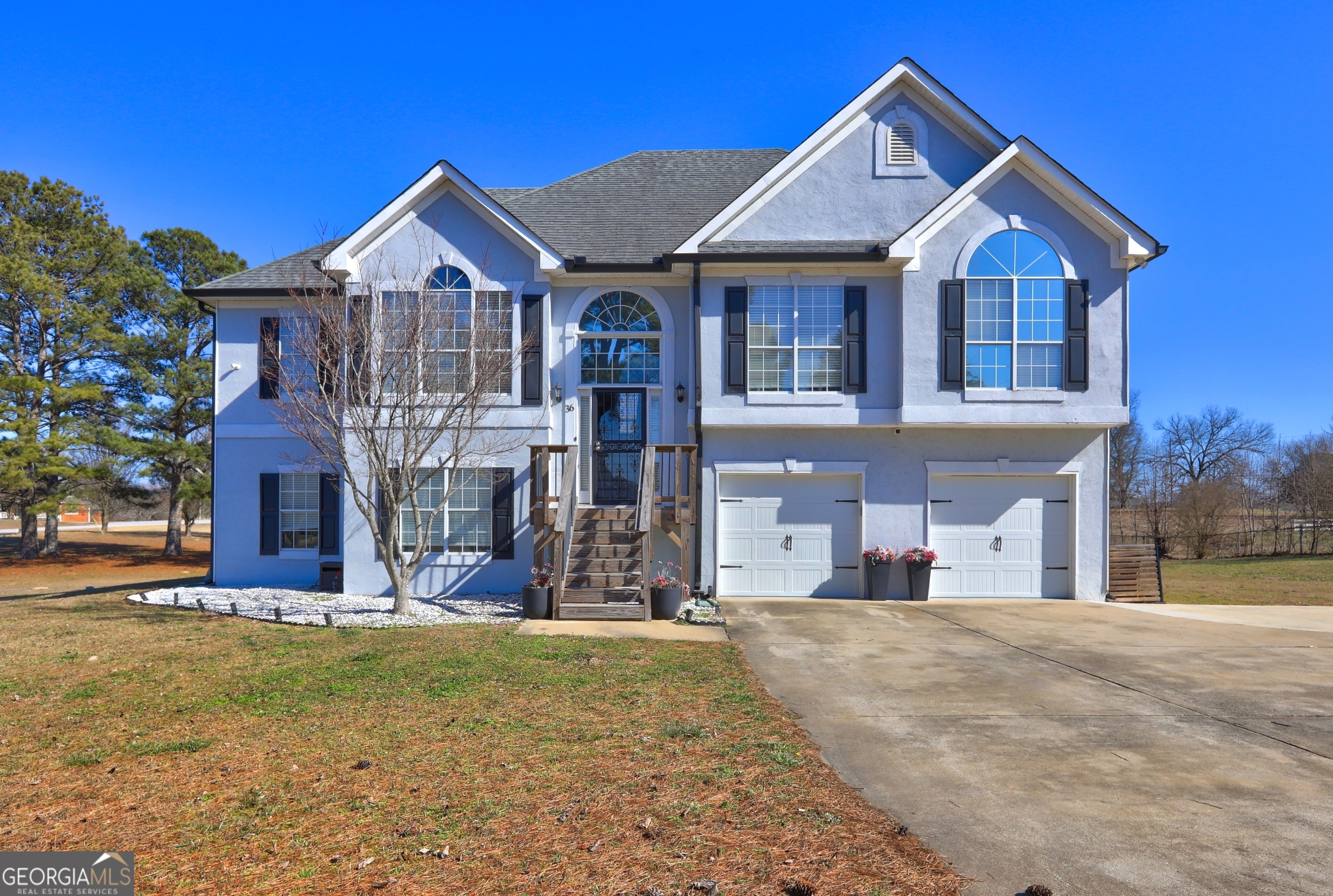 a front view of a house with a yard