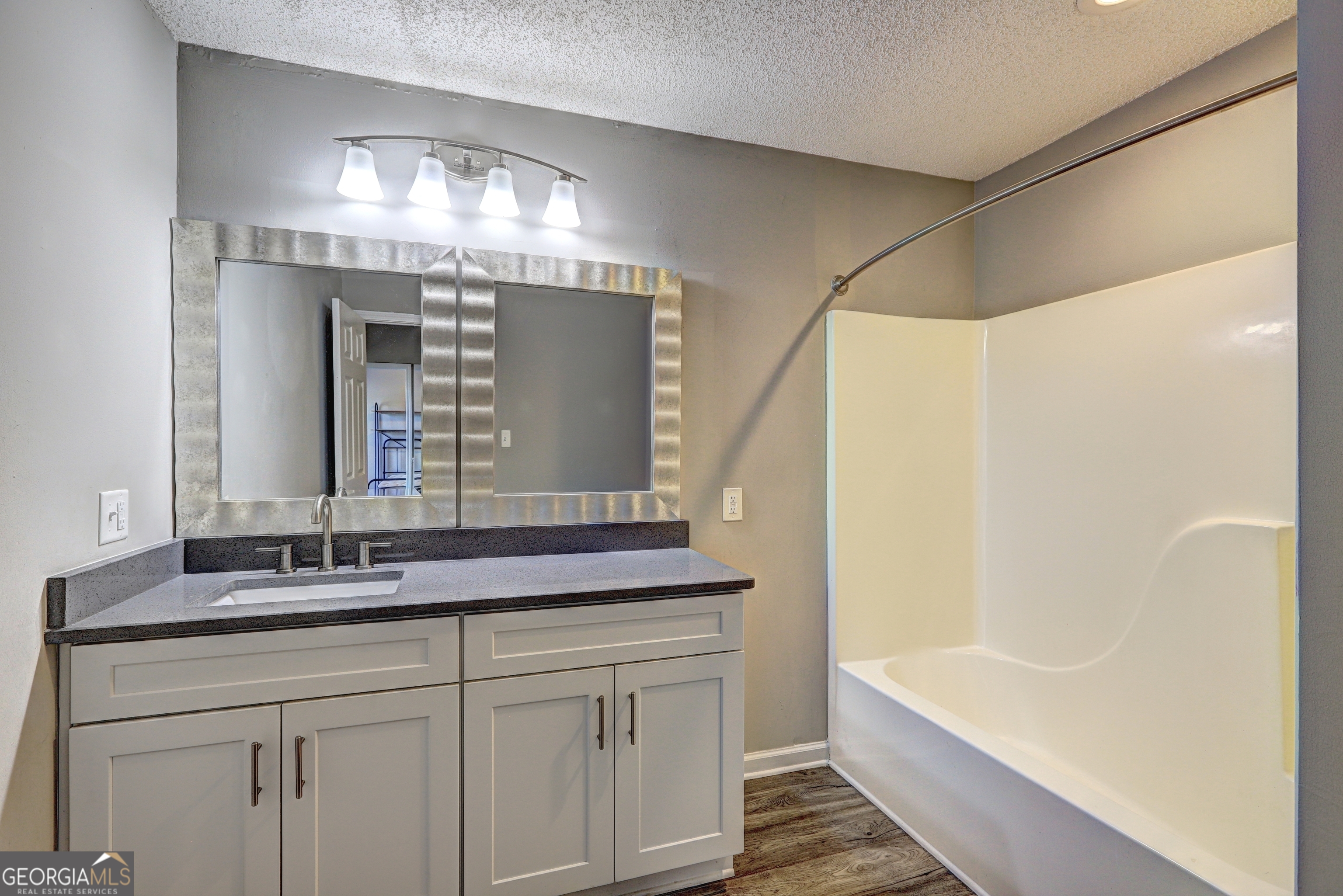 36 Snapfinger Trail Stockbridge, GA 30281 - Photo 14 of 17 a bathroom with a double vanity sink and a bathtub