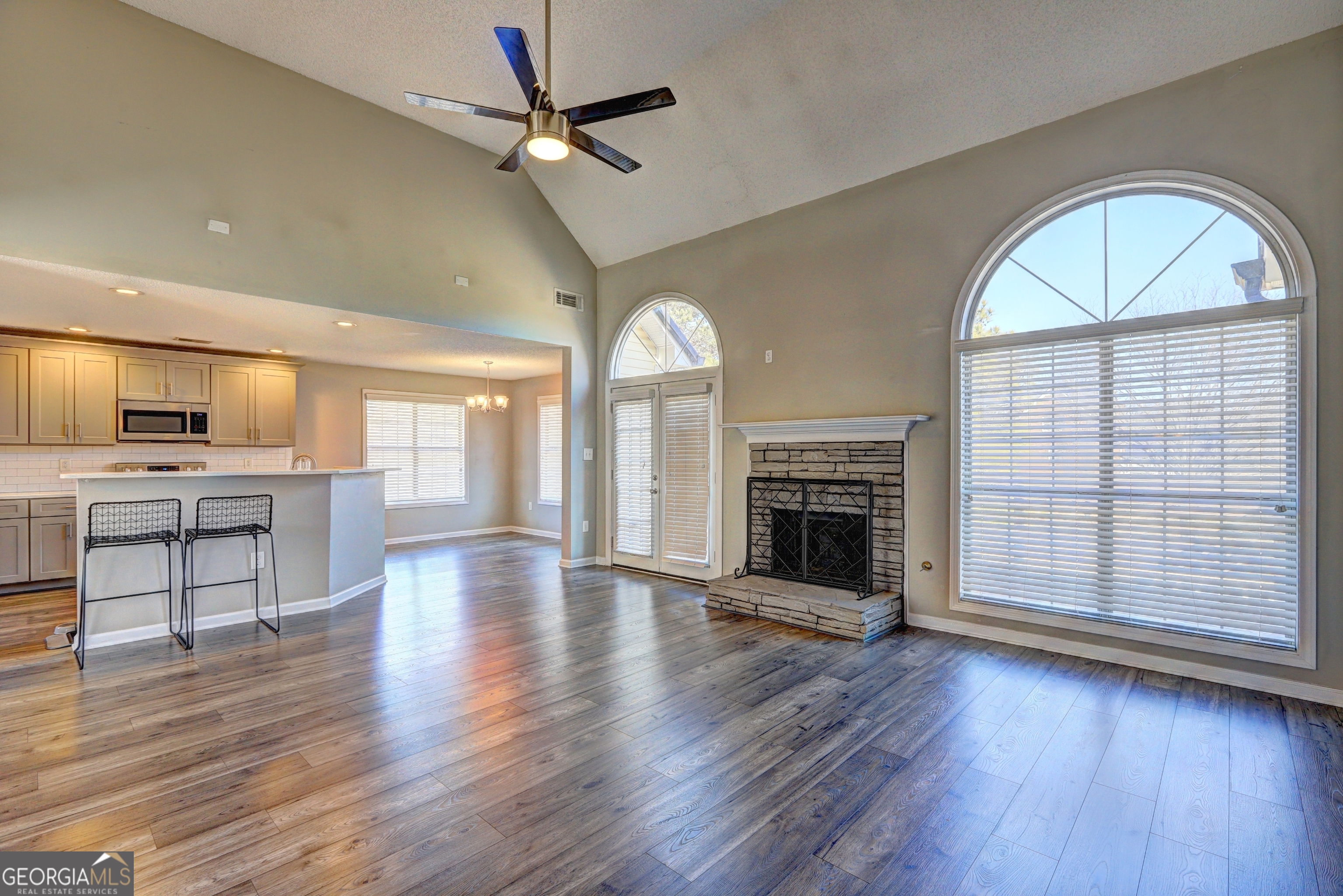 36 Snapfinger Trail Stockbridge, GA 30281 - Photo 2 of 17 a view of an empty room with a fireplace and wooden floor