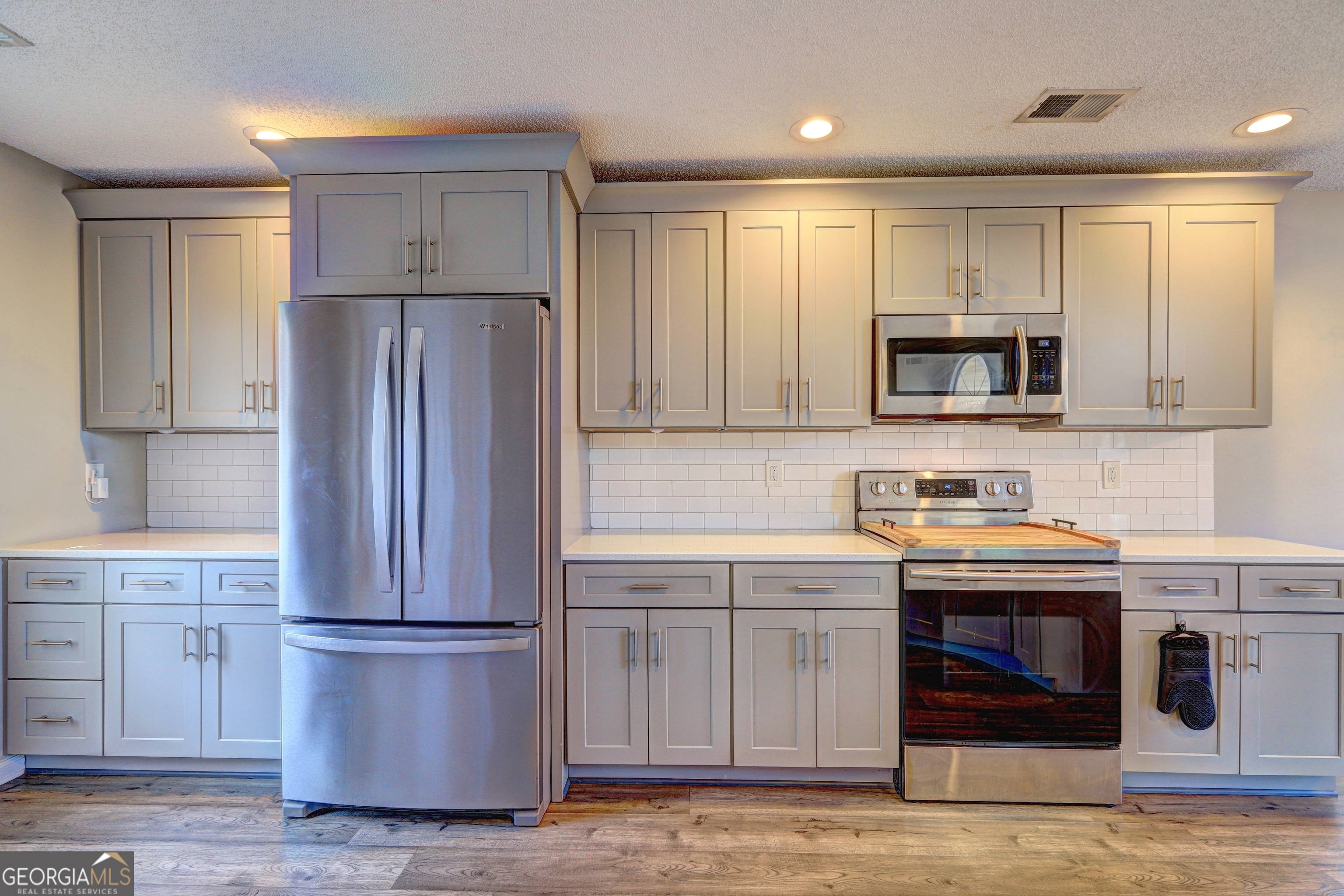 36 Snapfinger Trail Stockbridge, GA 30281 - Photo 6 of 17 a kitchen with a refrigerator sink and cabinets