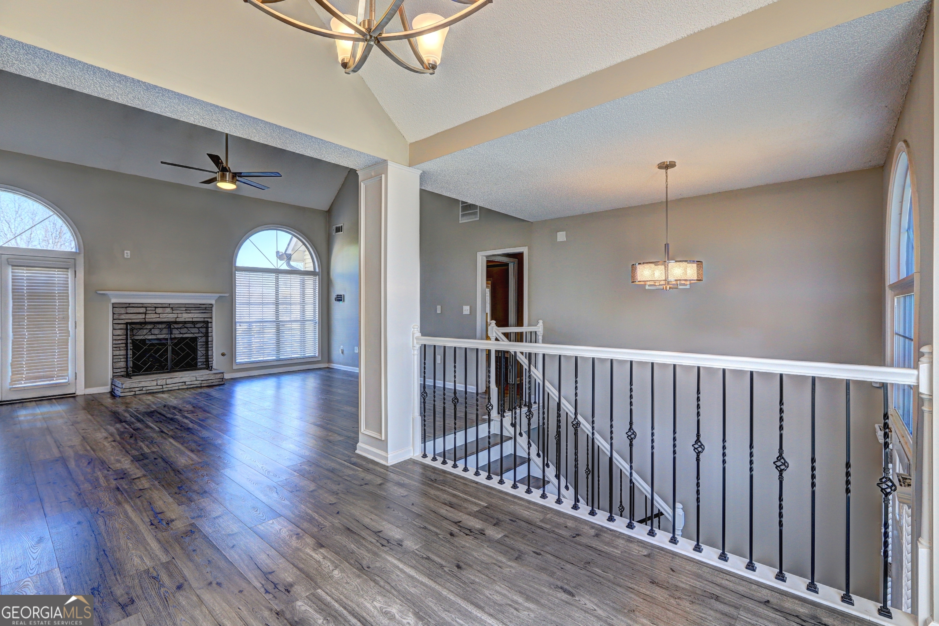 36 Snapfinger Trail Stockbridge, GA 30281 - Photo 8 of 17 a view of empty room with wooden floor and fireplace
