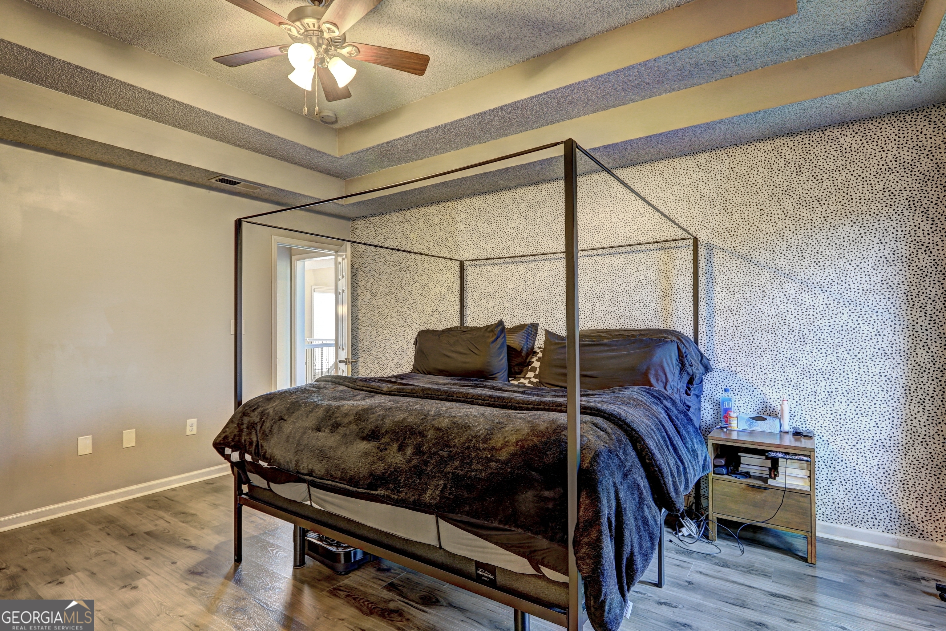 36 Snapfinger Trail Stockbridge, GA 30281 - Photo 9 of 17 a bedroom with a bed and a chandelier