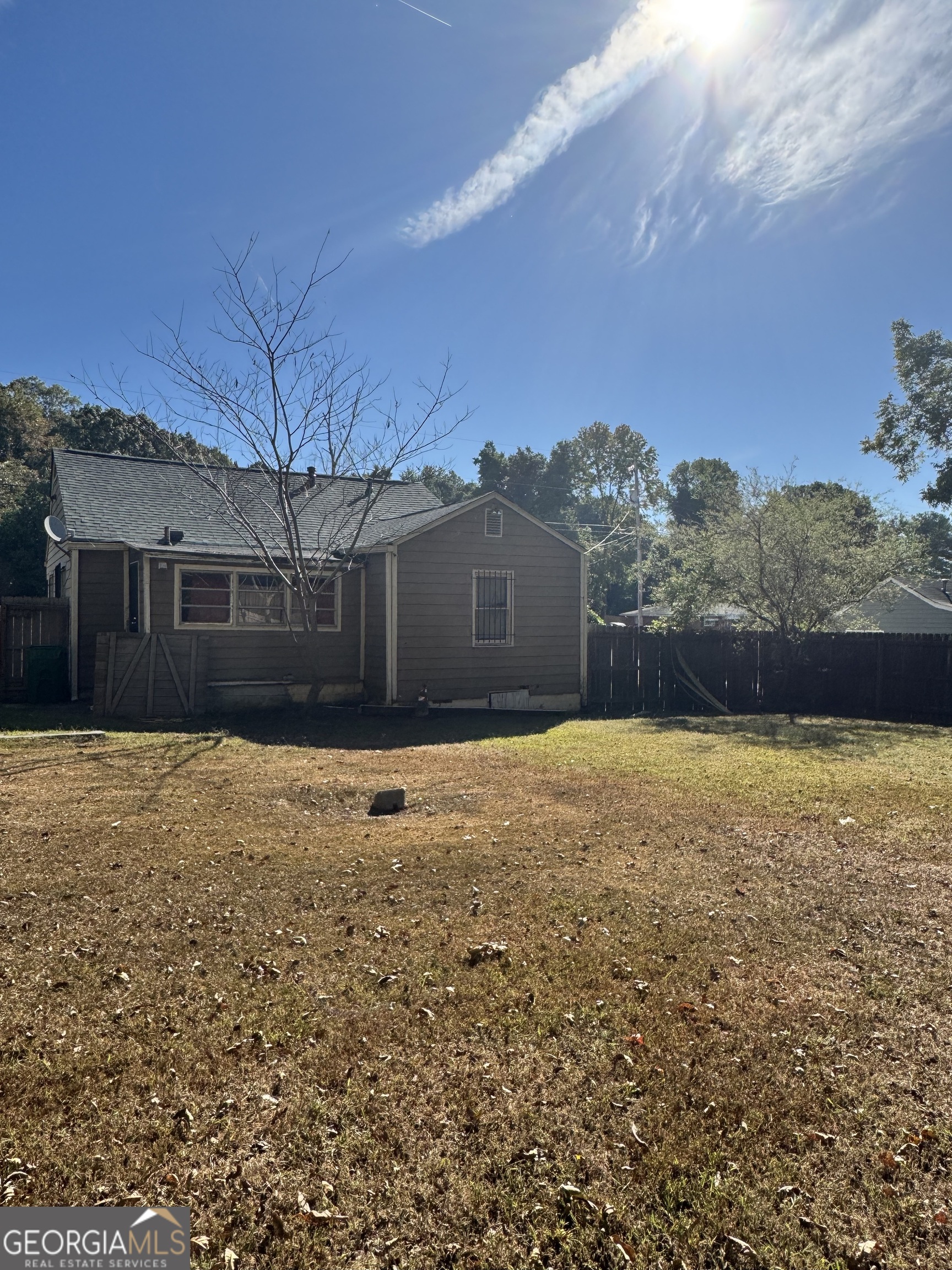 1179 Panola Road Stone Mountain, GA 30088 - Photo 14 of 15 a front view of a house with a yard