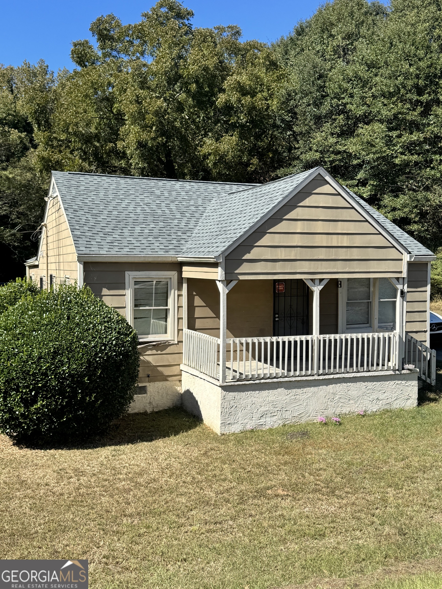 1179 Panola Road Stone Mountain, GA 30088 - Photo 2 of 15 a front view of a house with a yard