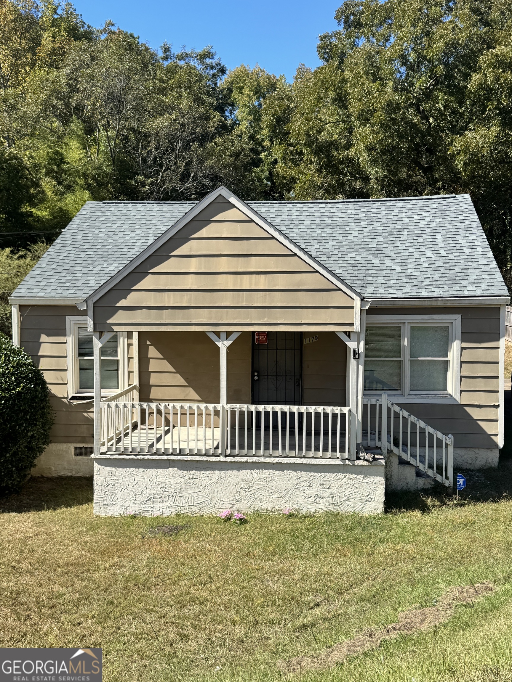 1179 Panola Road Stone Mountain, GA 30088 - Photo 3 of 15 a front view of a house with a yard