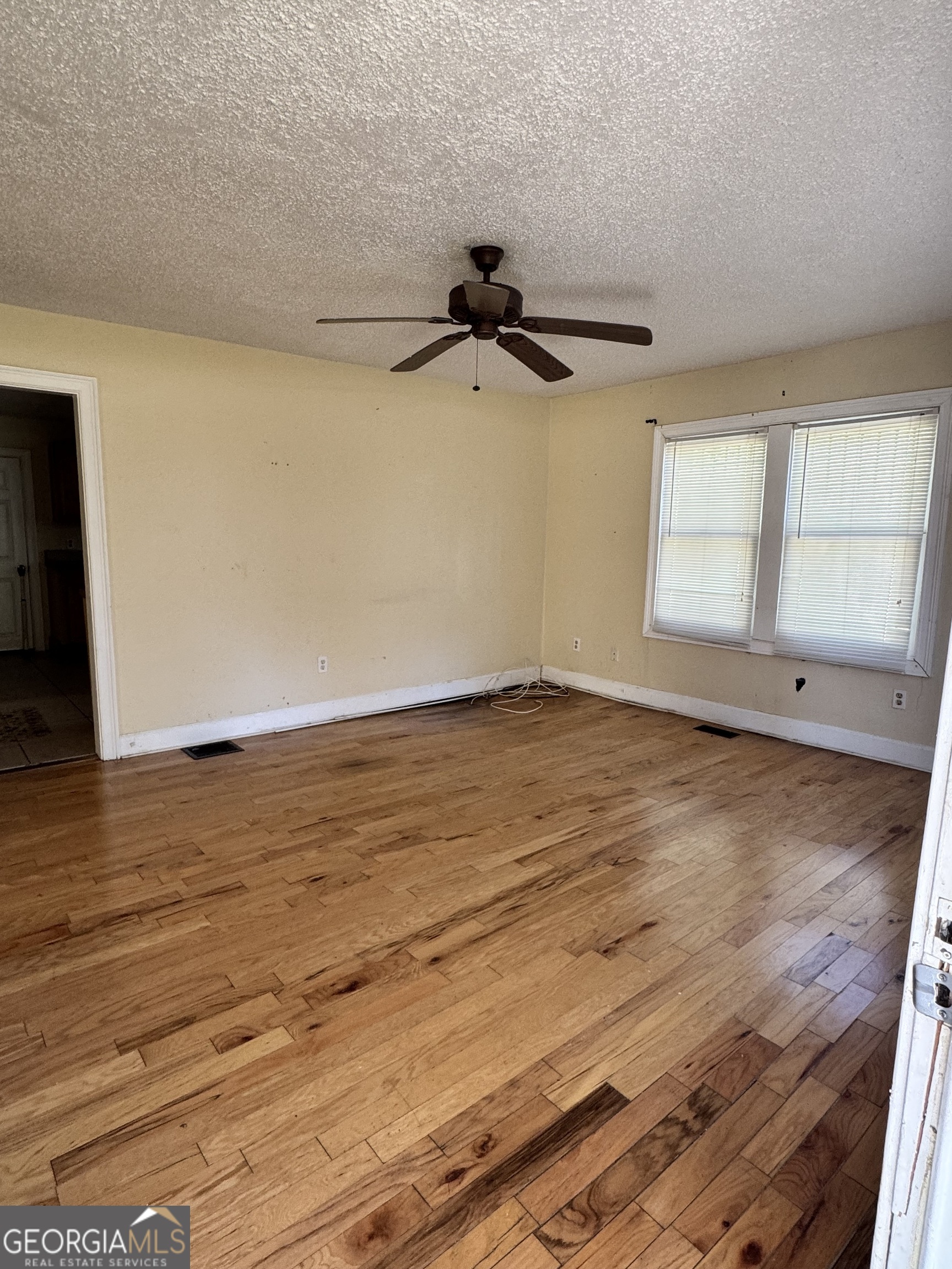 1179 Panola Road Stone Mountain, GA 30088 - Photo 4 of 15 wooden floor in an empty room