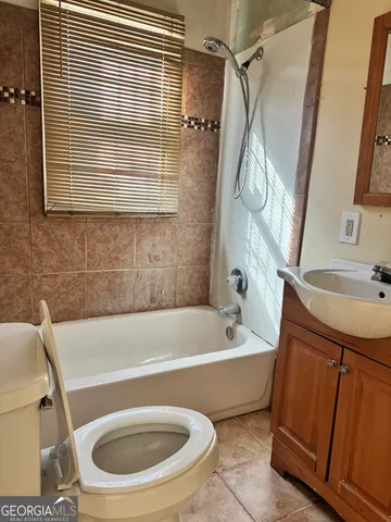a bathroom with a sink a bathtub and a shower