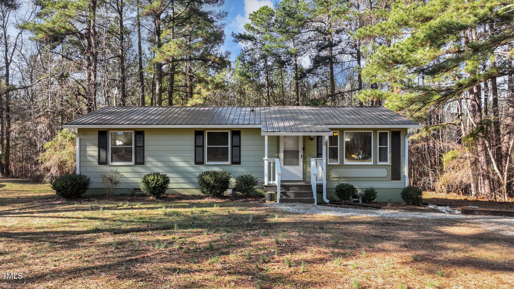 749 Fred Royster Road Henderson, NC 27537 - Photo 1 of 31 a front view of a house with a yard