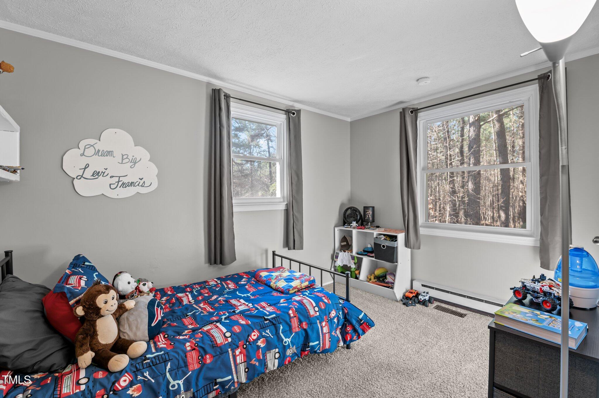 749 Fred Royster Road Henderson, NC 27537 - Photo 13 of 31 a bedroom with bed and window