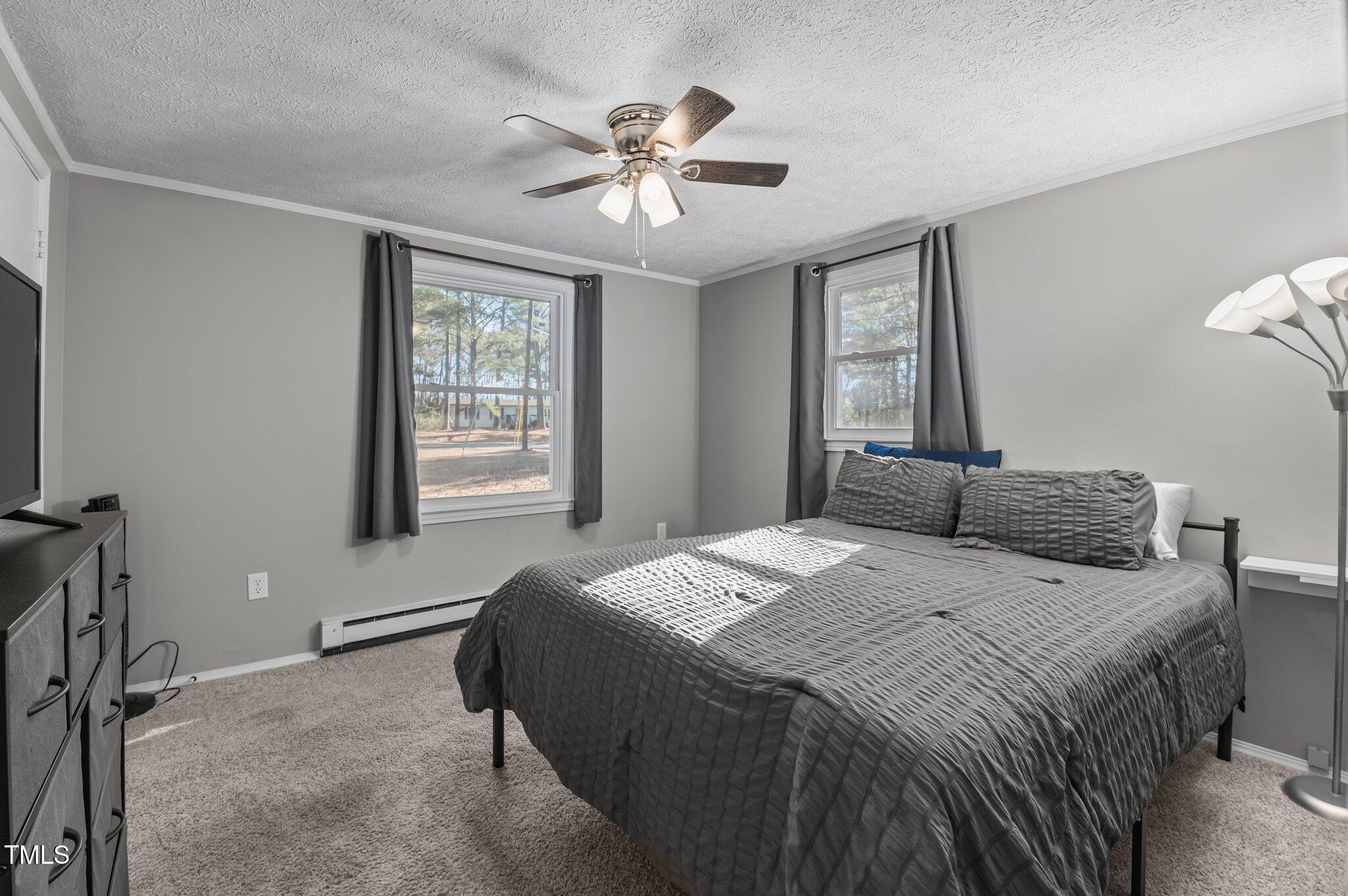 749 Fred Royster Road Henderson, NC 27537 - Photo 15 of 31 a bedroom with a bed and window