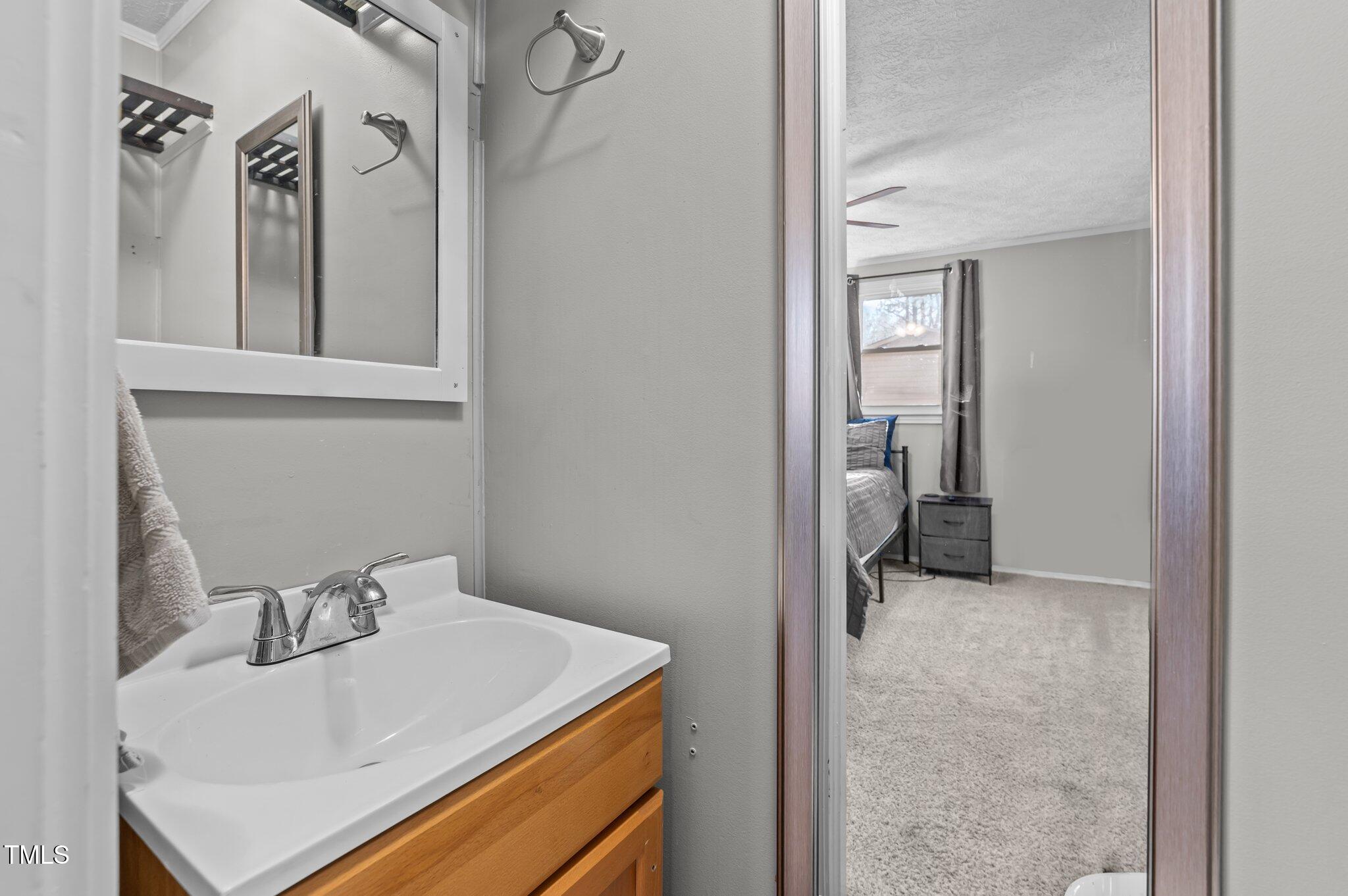 749 Fred Royster Road Henderson, NC 27537 - Photo 17 of 31 a bathroom with a sink a toilet and shower