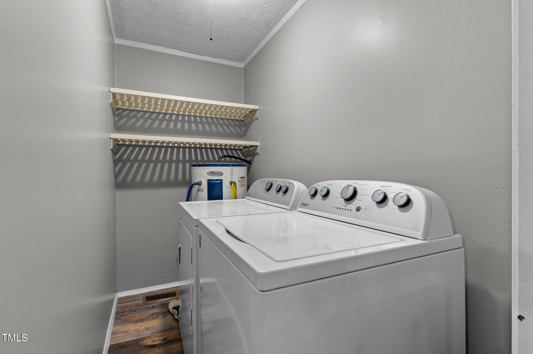 749 Fred Royster Road Henderson, NC 27537 - Photo 19 of 31 a utility room with dryer and washer