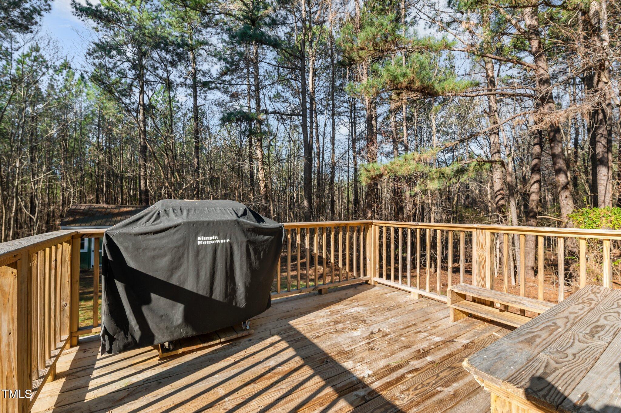 749 Fred Royster Road Henderson, NC 27537 - Photo 20 of 31 a view of balcony with wooden floor and fence