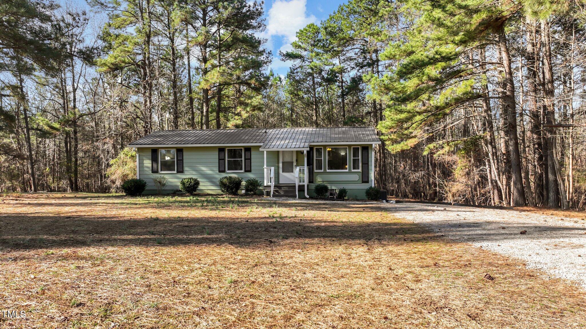 749 Fred Royster Road Henderson, NC 27537 - Photo 21 of 31 a front view of a house with a yard