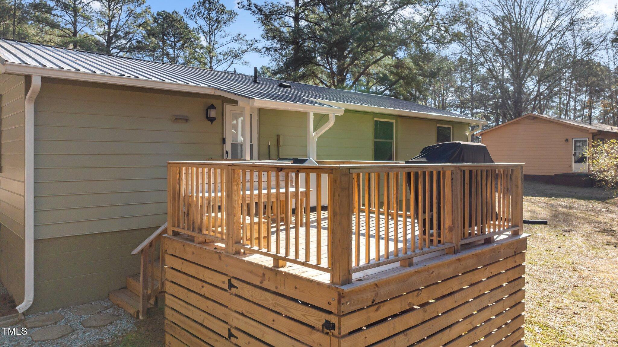 749 Fred Royster Road Henderson, NC 27537 - Photo 23 of 31 a view of a house with wooden deck