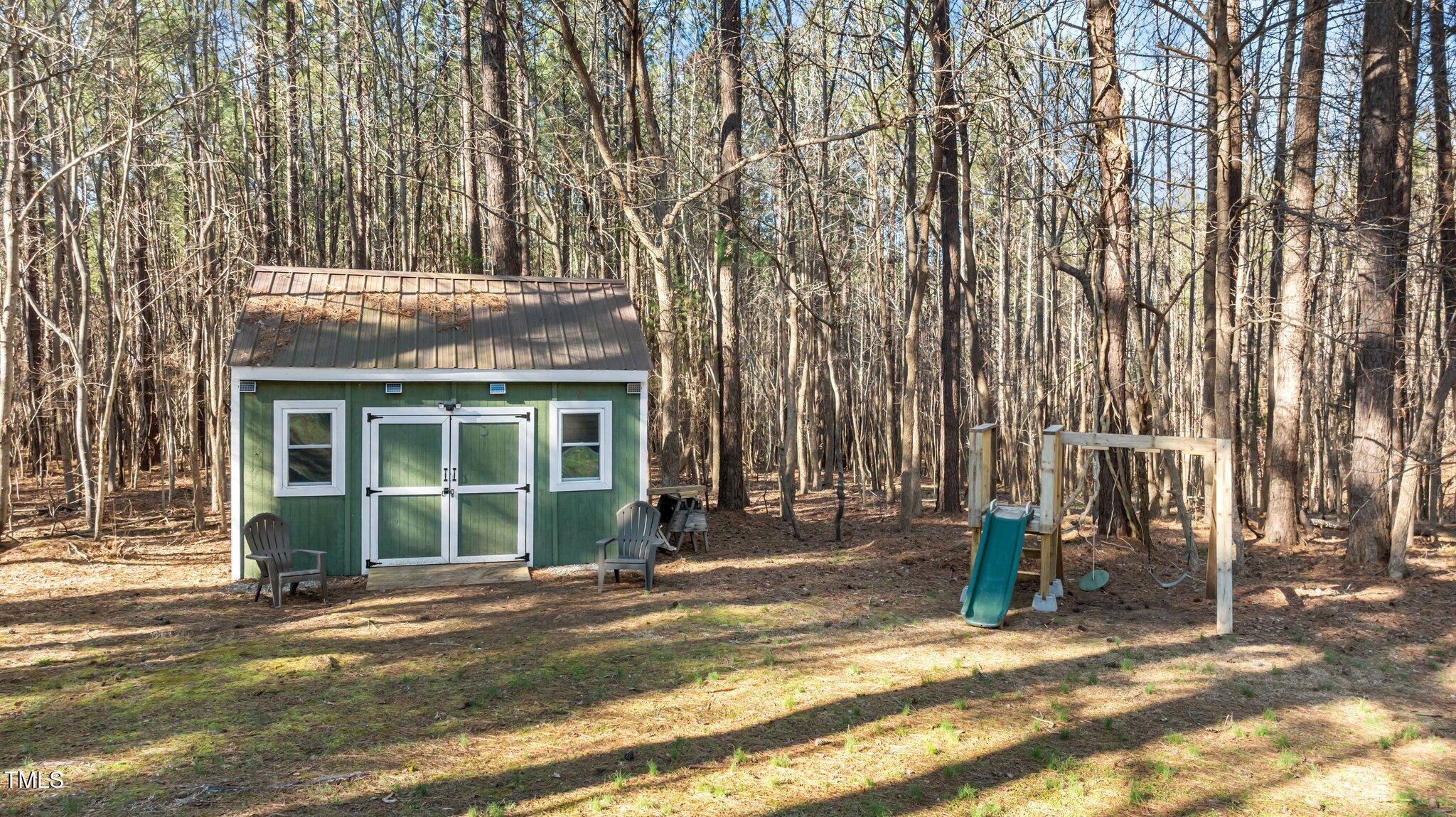 749 Fred Royster Road Henderson, NC 27537 - Photo 24 of 31 a front view of a house with a garden
