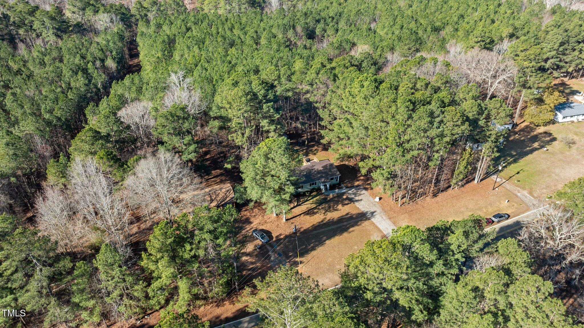 749 Fred Royster Road Henderson, NC 27537 - Photo 28 of 31 a view of a garden with a tree