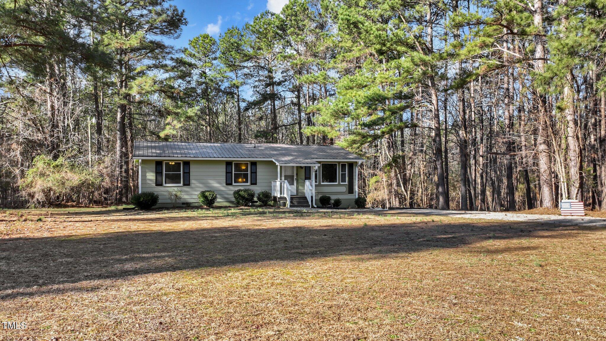 749 Fred Royster Road Henderson, NC 27537 - Photo 2 of 31 a front view of a house with a yard