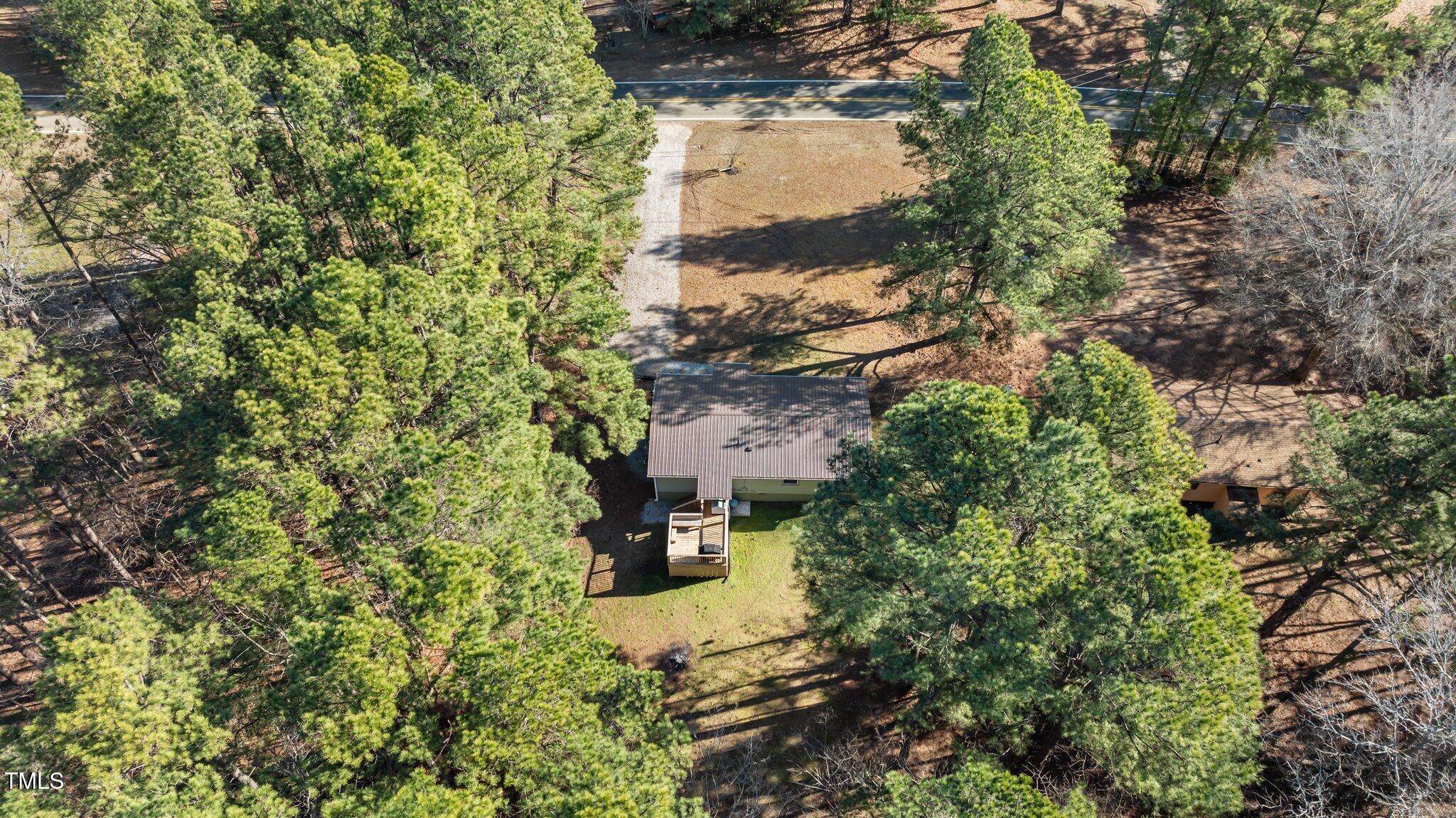 749 Fred Royster Road Henderson, NC 27537 - Photo 30 of 31 an aerial view of residential house with outdoor space and trees all around