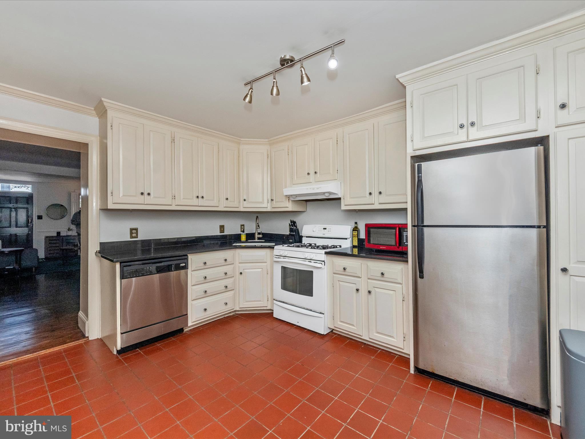 23 East Wheeling Street Baltimore, MD 21230 - Photo 14 of 51 a kitchen with granite countertop stainless steel appliances refrigerator sink and cabinets