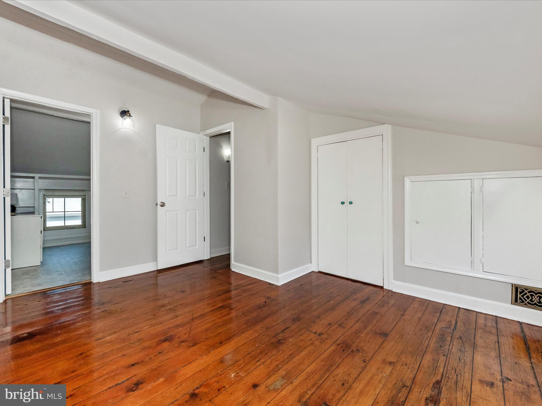 23 East Wheeling Street Baltimore, MD 21230 - Photo 19 of 51 a view of an empty room with wooden floor