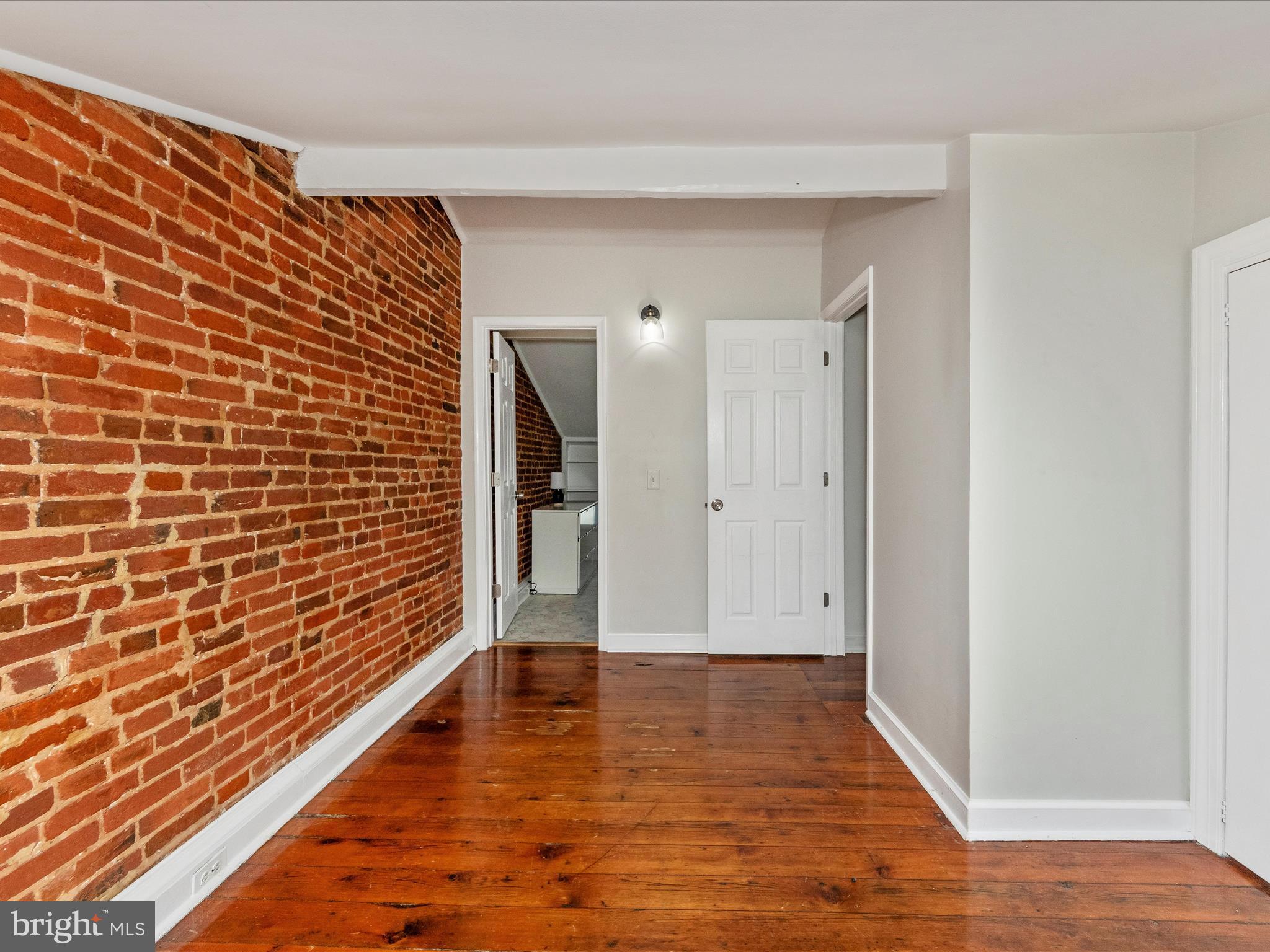 23 East Wheeling Street Baltimore, MD 21230 - Photo 20 of 51 a view of empty room with wooden floor