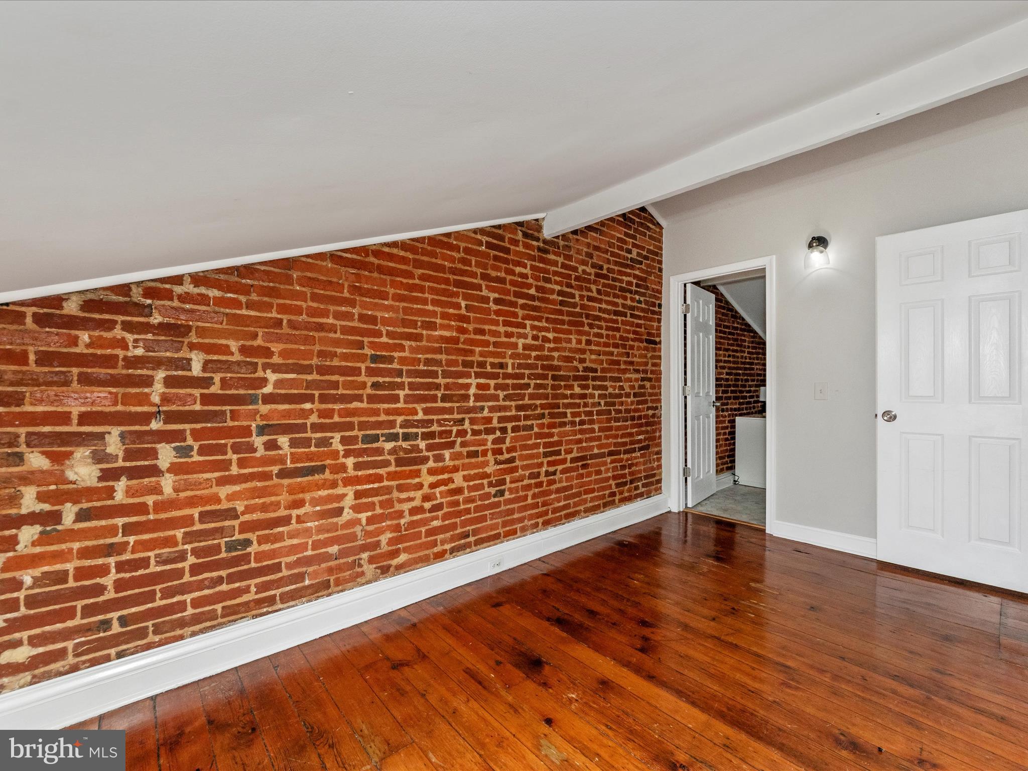 23 East Wheeling Street Baltimore, MD 21230 - Photo 21 of 51 a view of an empty room with wooden floor