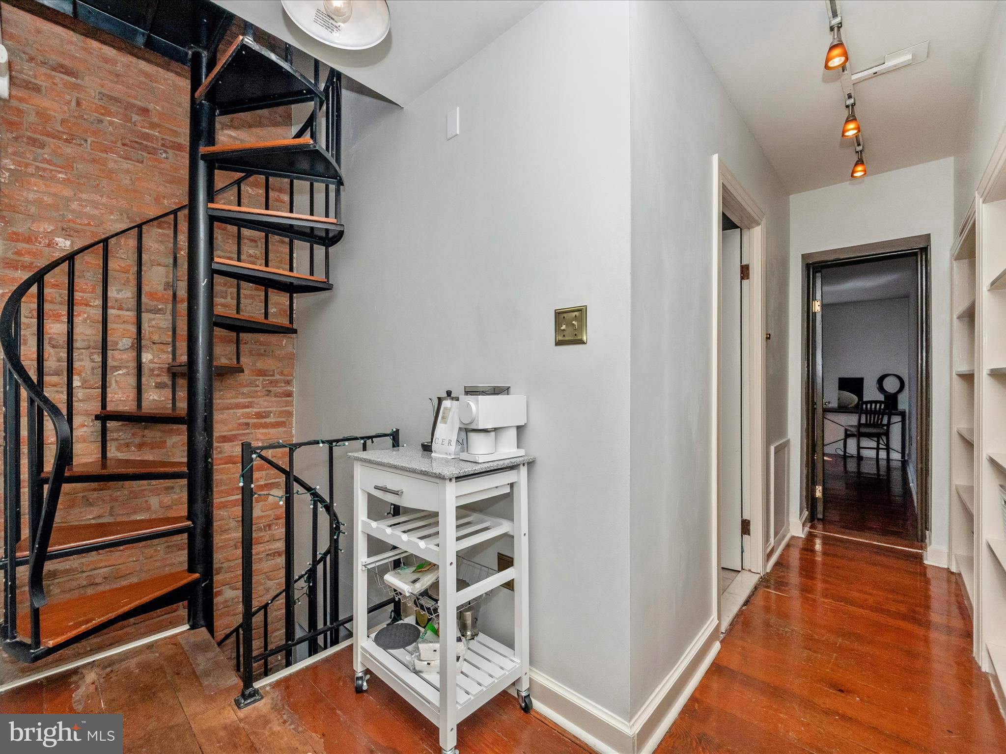 23 East Wheeling Street Baltimore, MD 21230 - Photo 26 of 51 a view of a hallway with wooden floor and staircase