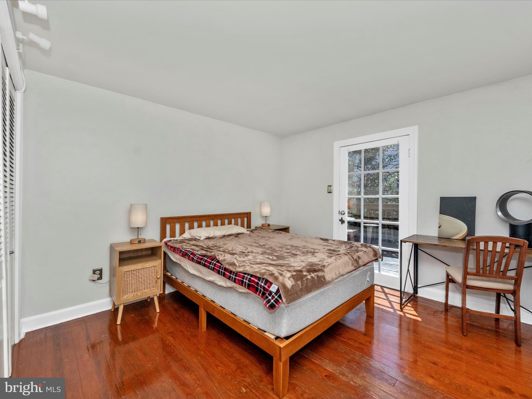 23 East Wheeling Street Baltimore, MD 21230 - Photo 27 of 51 a bed sitting in a bedroom next to a window and chair