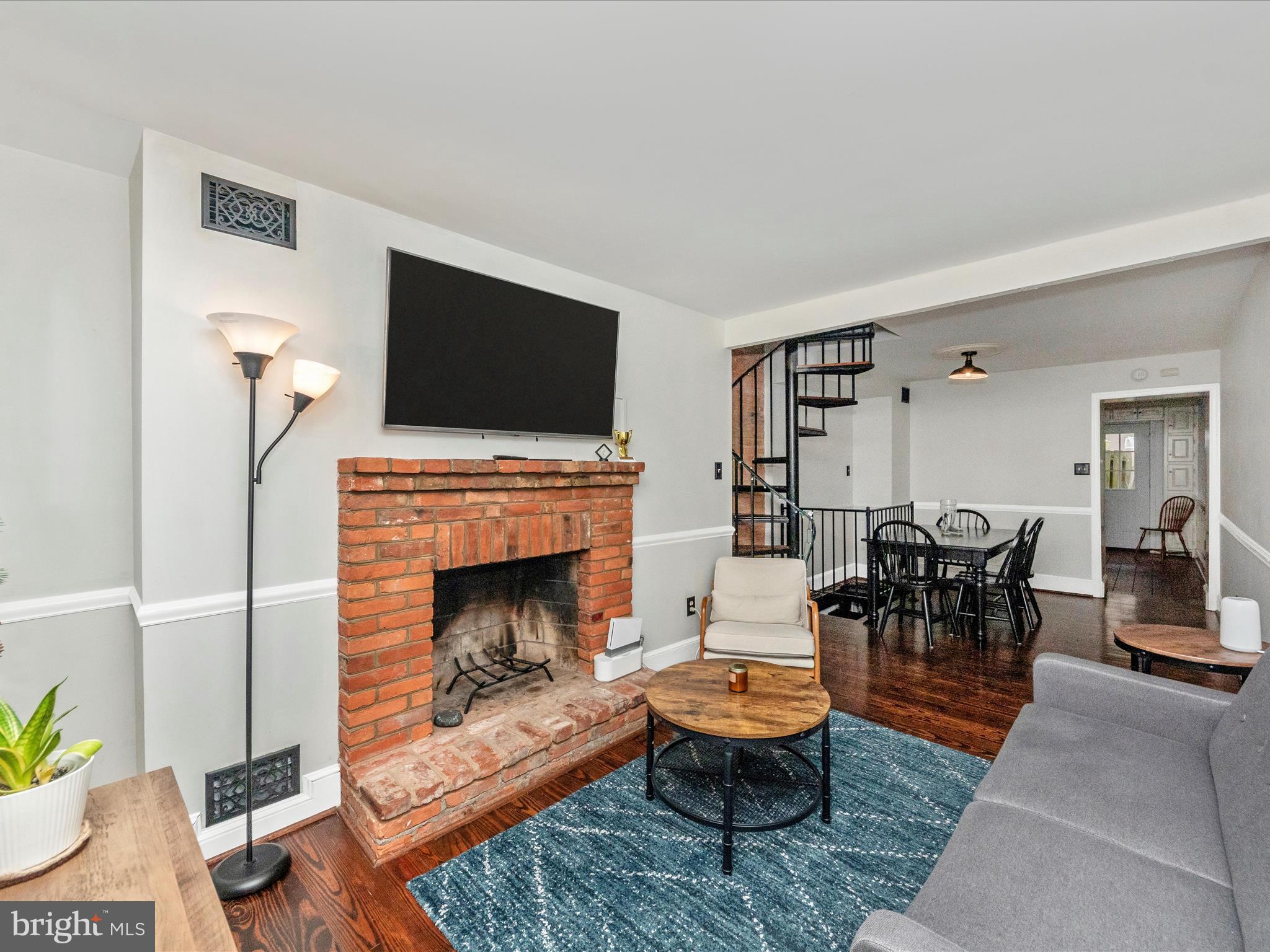 23 East Wheeling Street Baltimore, MD 21230 - Photo 3 of 51 a living room with furniture and a fireplace